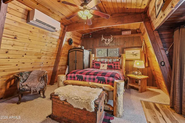 a bedroom with a bed and a mirror