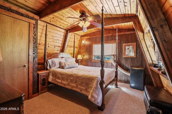 a view of backyard with outdoor seating and trees