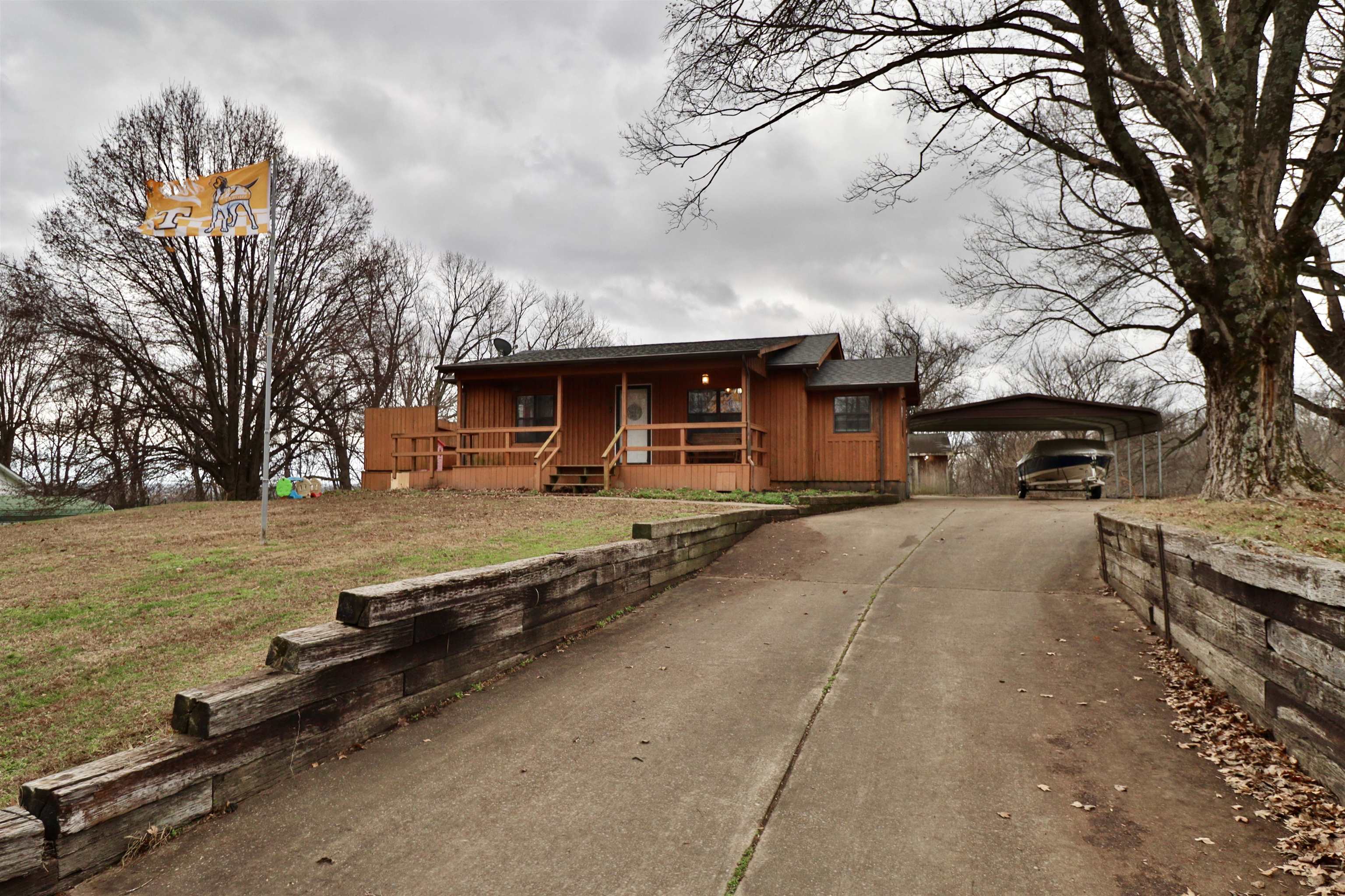 117 Charlie Ennis Road Dyersburg, TN 38024 - Photo 1 of 40 a car parked on the side of the road