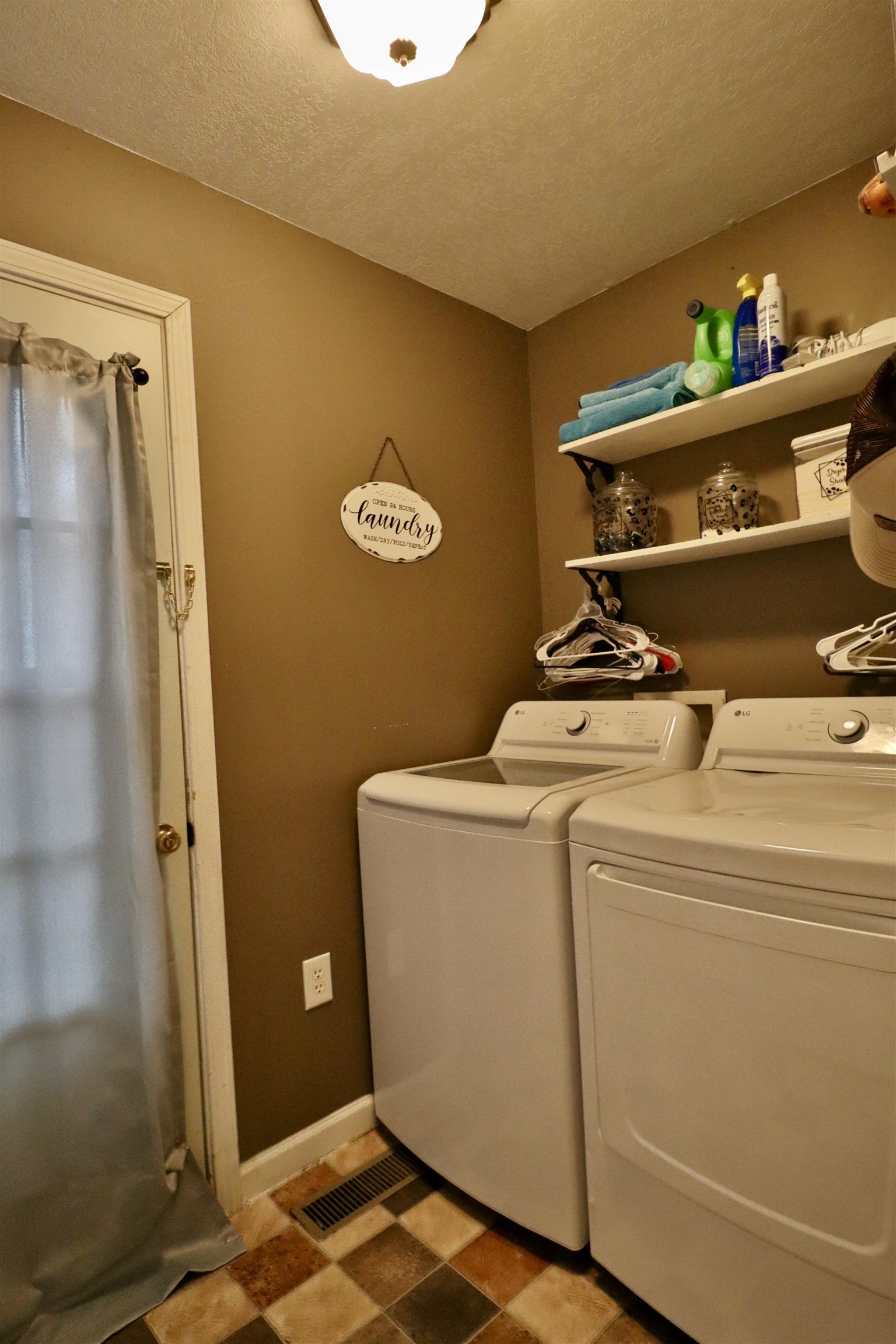 117 Charlie Ennis Road Dyersburg, TN 38024 - Photo 19 of 40 a utility room with dryer and washer