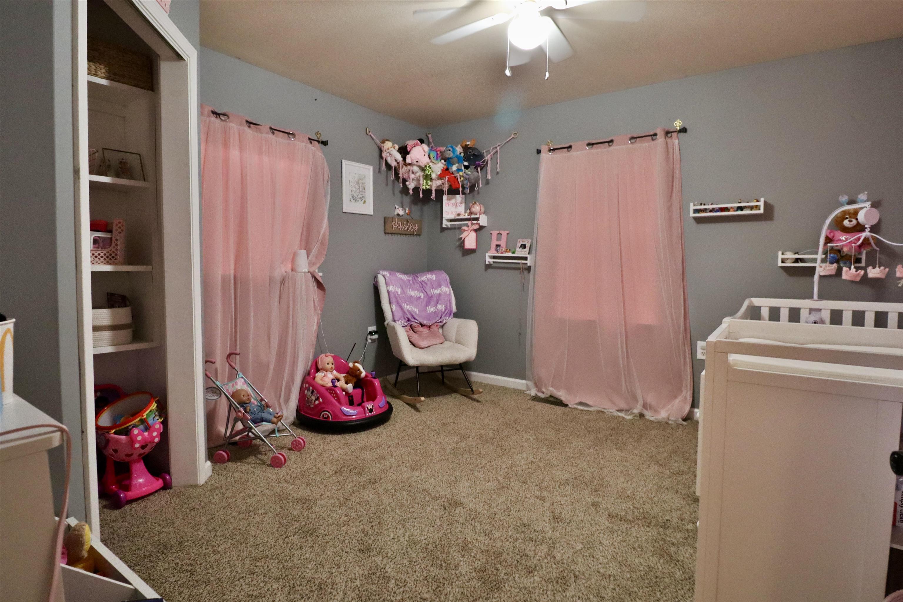 117 Charlie Ennis Road Dyersburg, TN 38024 - Photo 20 of 40 a bedroom with a bed and a window