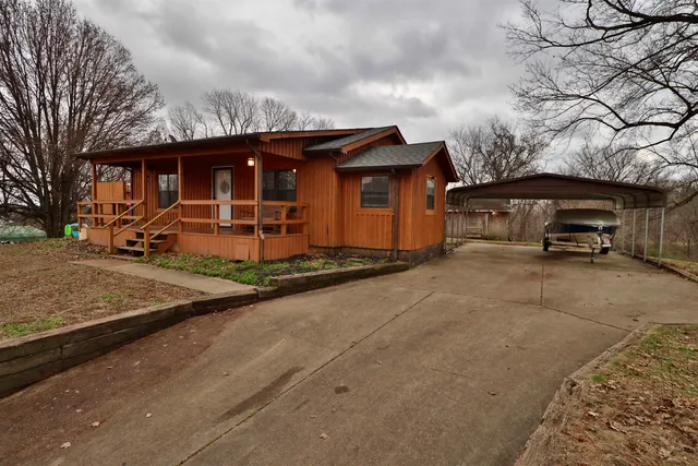 a view of a car park in front of house