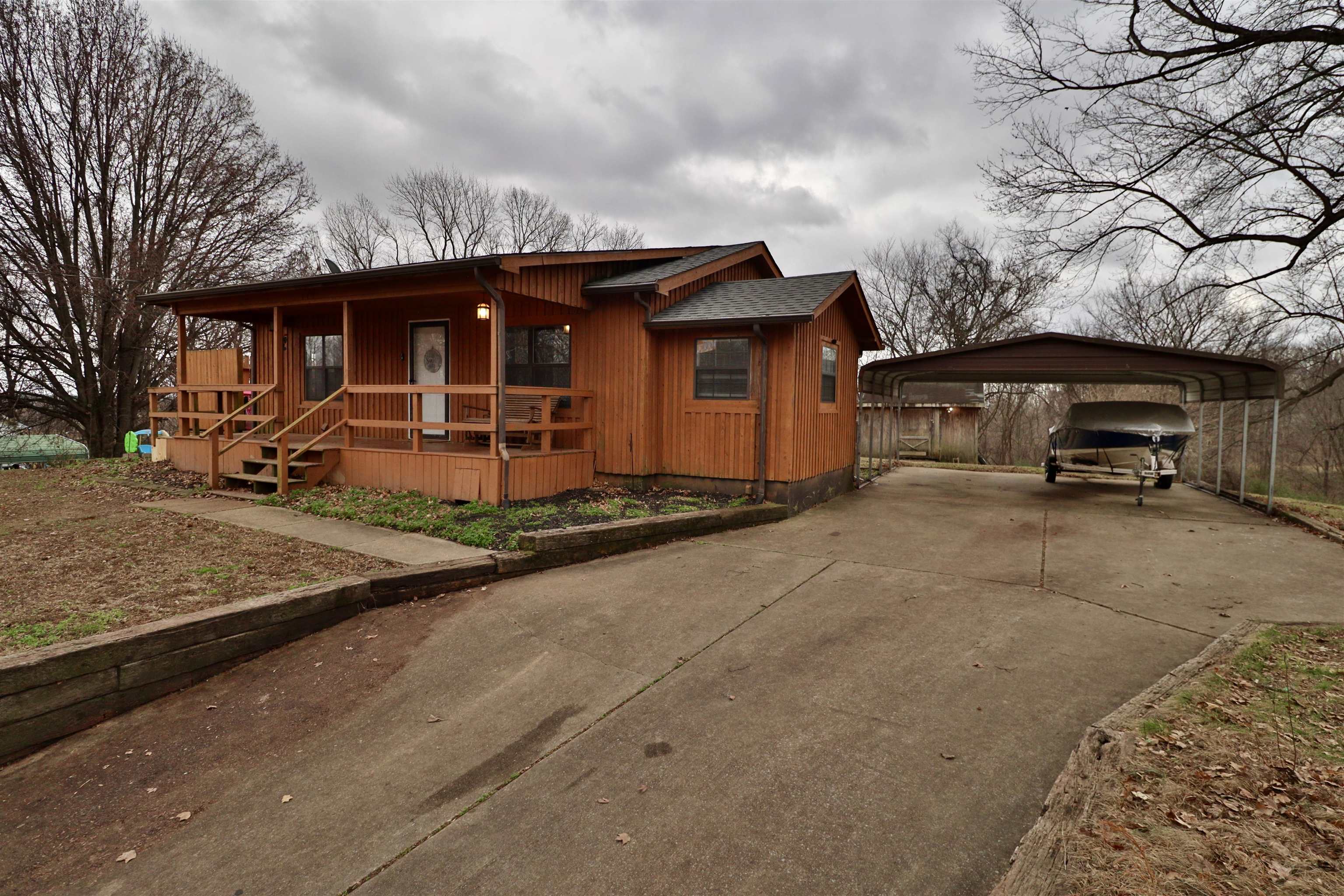 117 Charlie Ennis Road Dyersburg, TN 38024 - Photo 2 of 40 a view of a car park in front of house