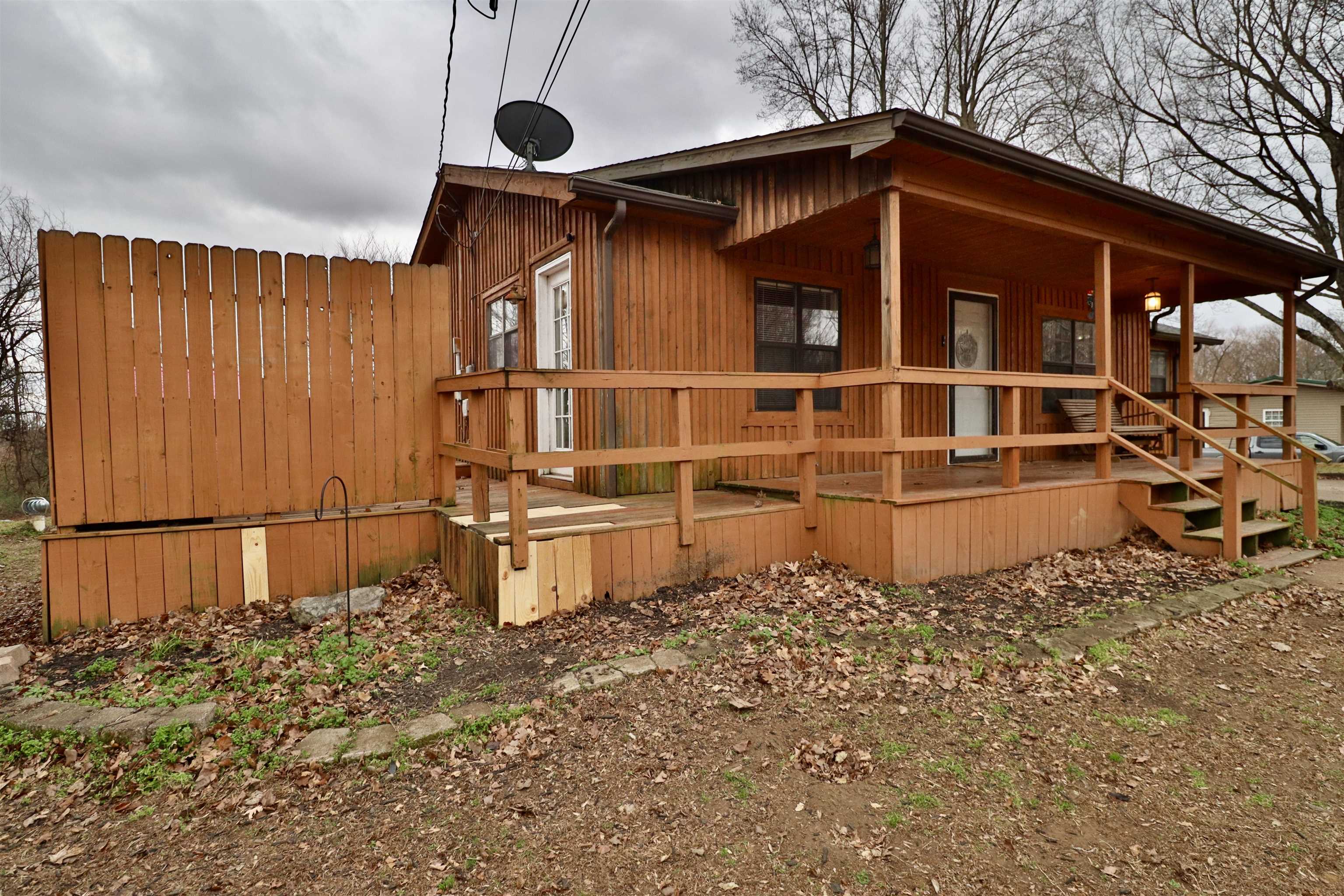 117 Charlie Ennis Road Dyersburg, TN 38024 - Photo 32 of 40 a front view of a house with parking space
