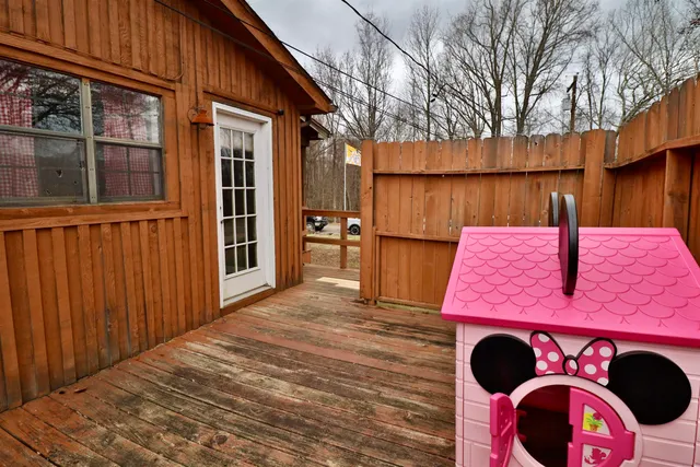 a view of a wooden house with a patio