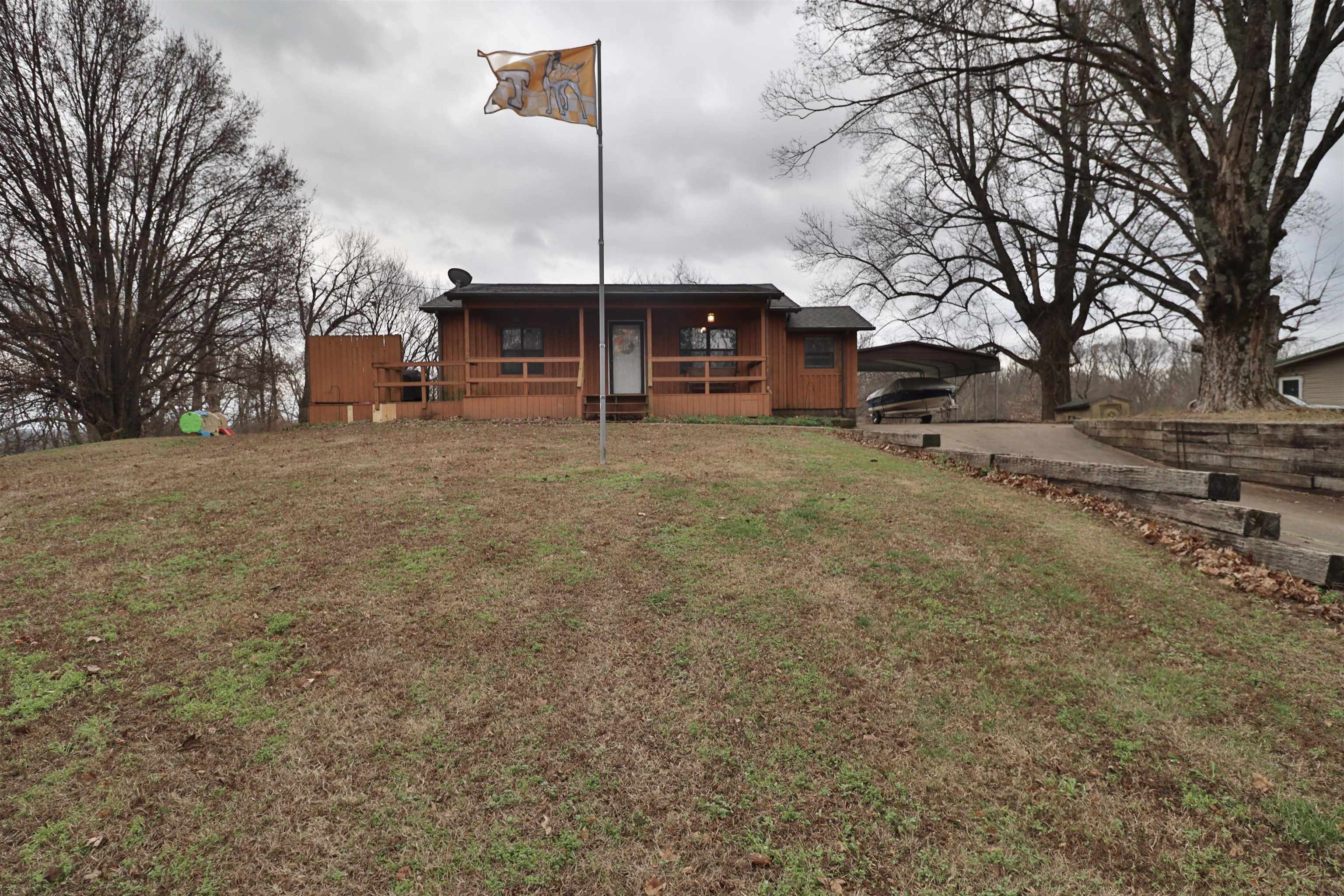 117 Charlie Ennis Road Dyersburg, TN 38024 - Photo 36 of 40 a view of a house with a yard