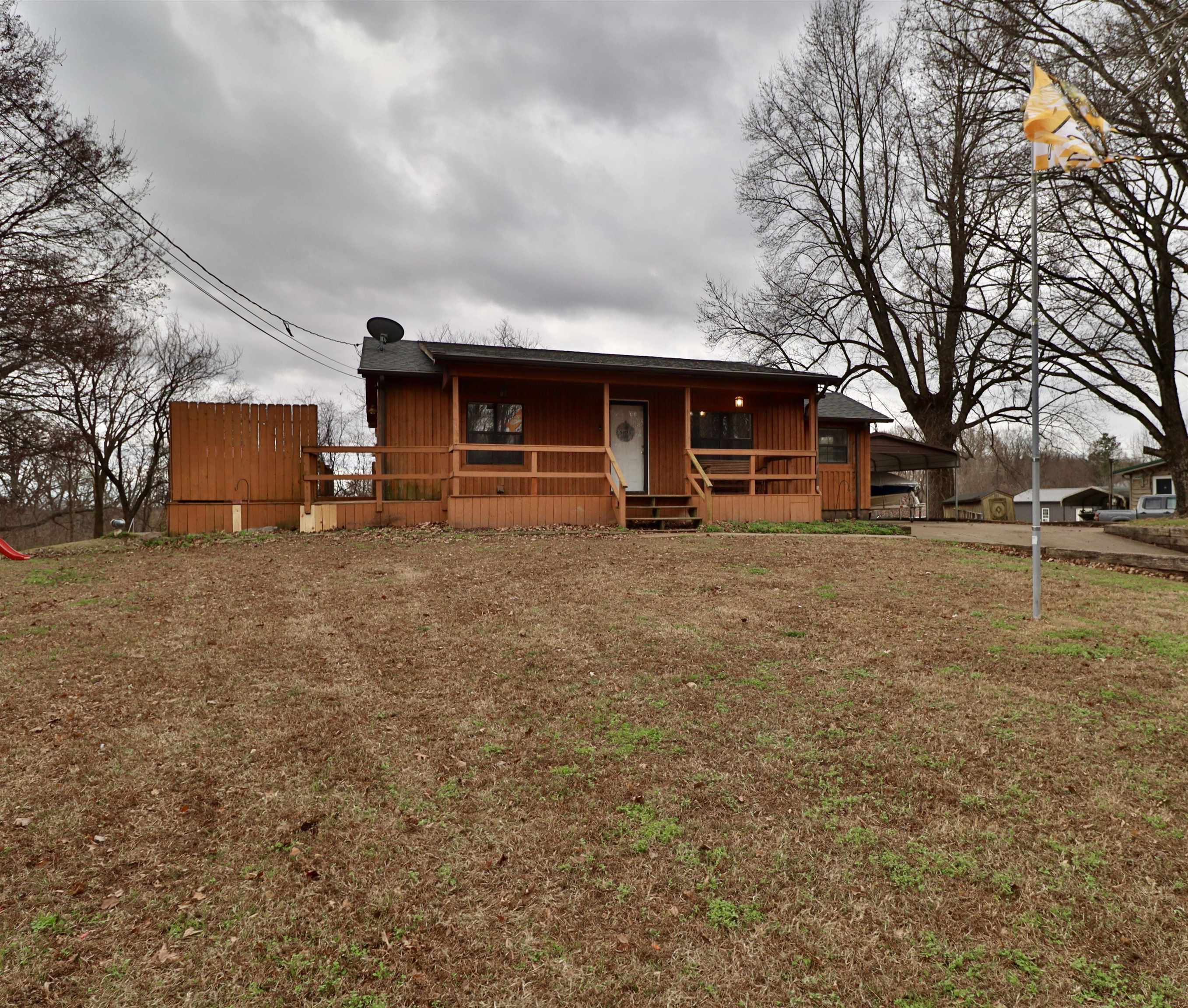 117 Charlie Ennis Road Dyersburg, TN 38024 - Photo 38 of 40 a view of a house with a yard