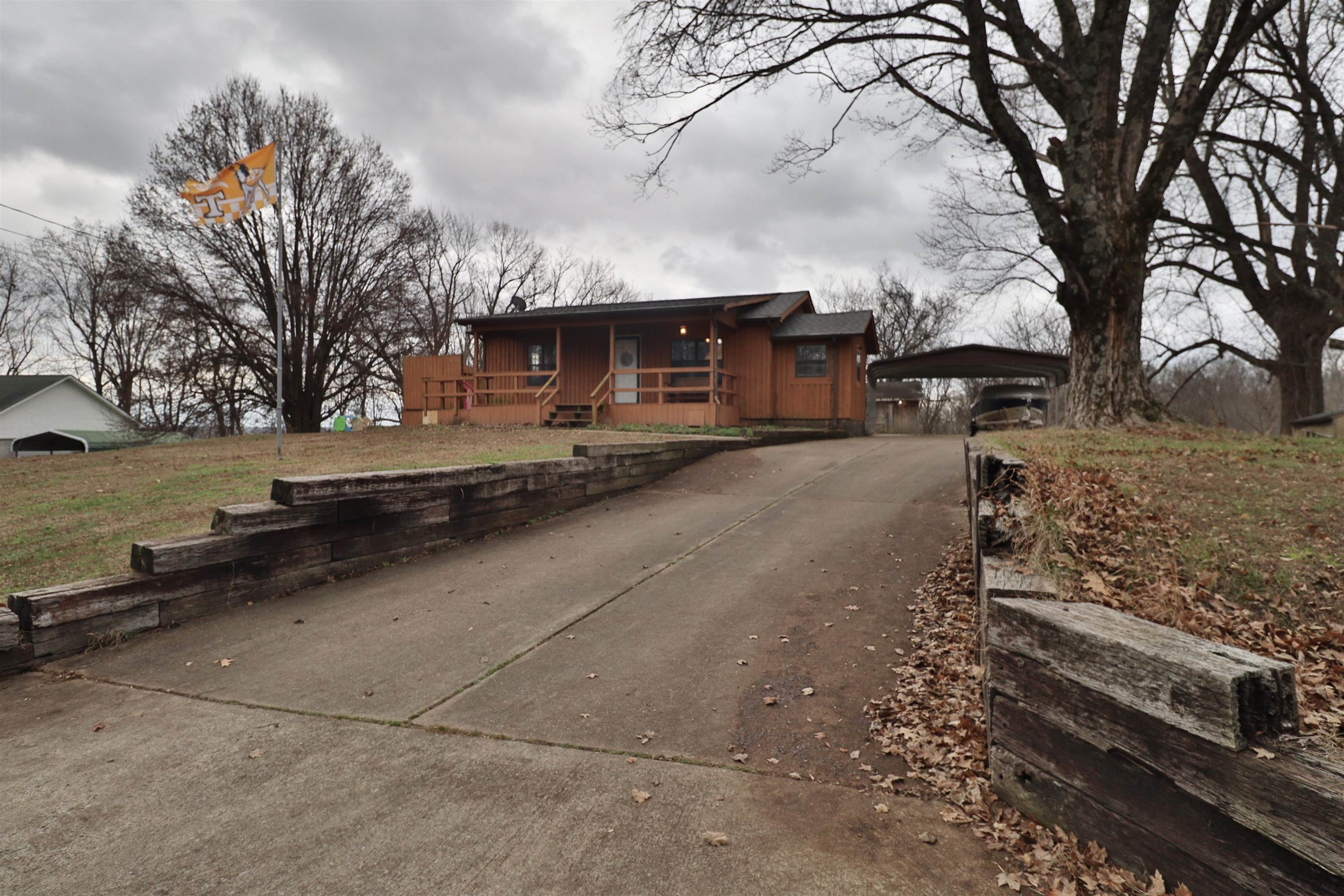 117 Charlie Ennis Road Dyersburg, TN 38024 - Photo 40 of 40 a view of a yard and car parked