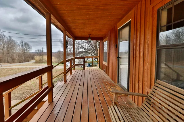 a view of balcony with wooden floor