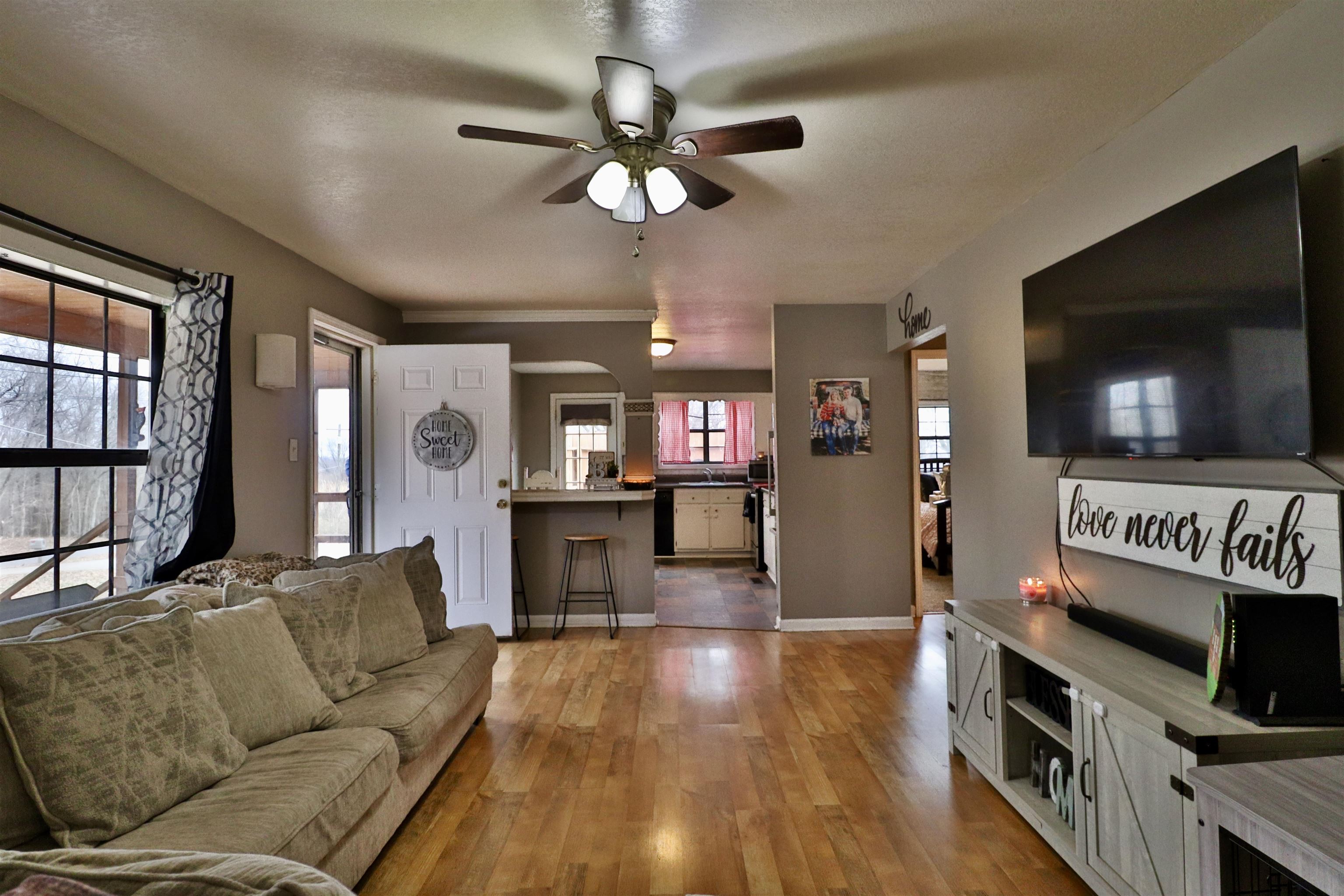 117 Charlie Ennis Road Dyersburg, TN 38024 - Photo 6 of 40 a living room with furniture and a flat screen tv