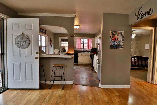 a view of kitchen with furniture and wooden floor
