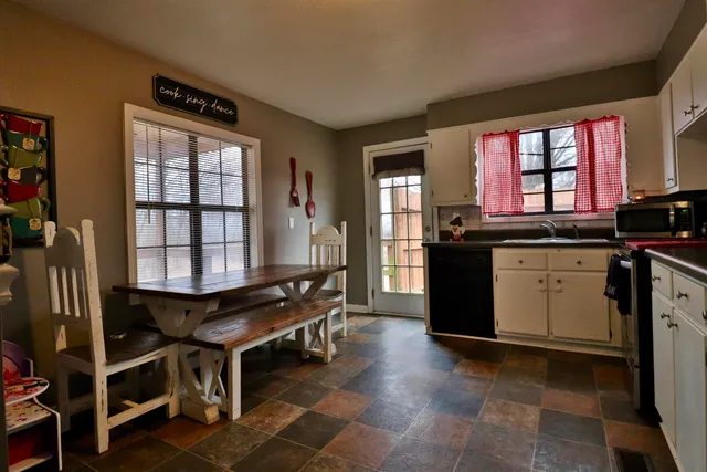 a kitchen with a stove a sink and a refrigerator