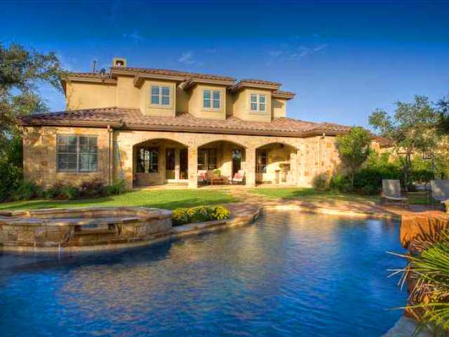 a front view of a house with swimming pool