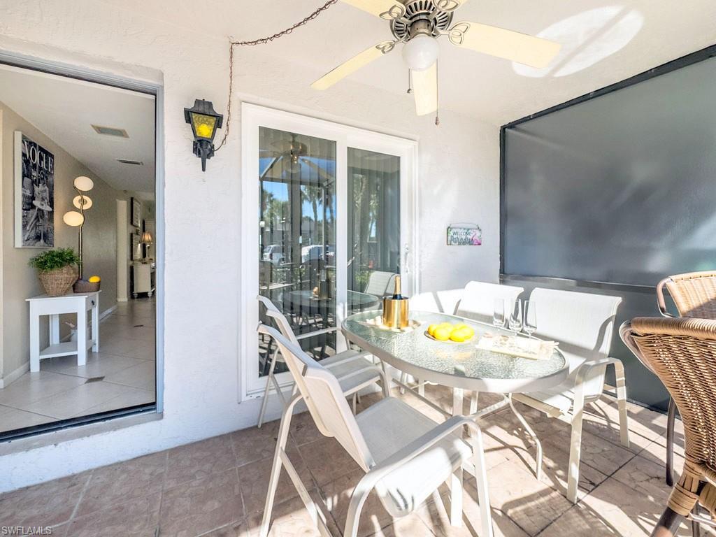 4085 Northlight Drive, Unit 5607 Naples, FL 34112 - Photo 37 of 49 a view of a dining room with furniture and wooden floor