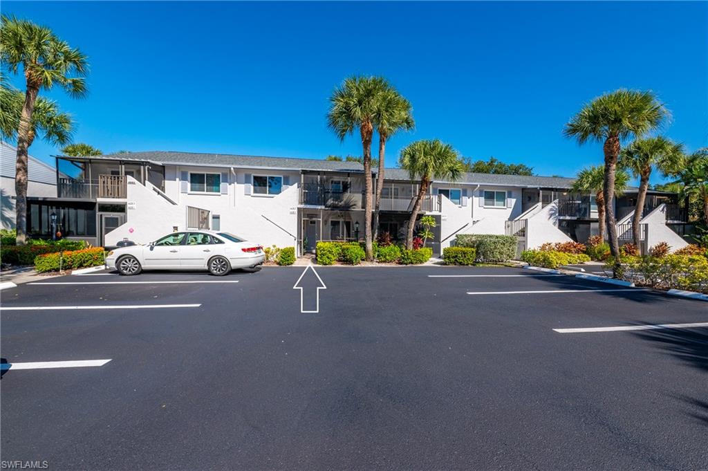 4085 Northlight Drive, Unit 5607 Naples, FL 34112 - Photo 38 of 49 a car parked on the side of the road