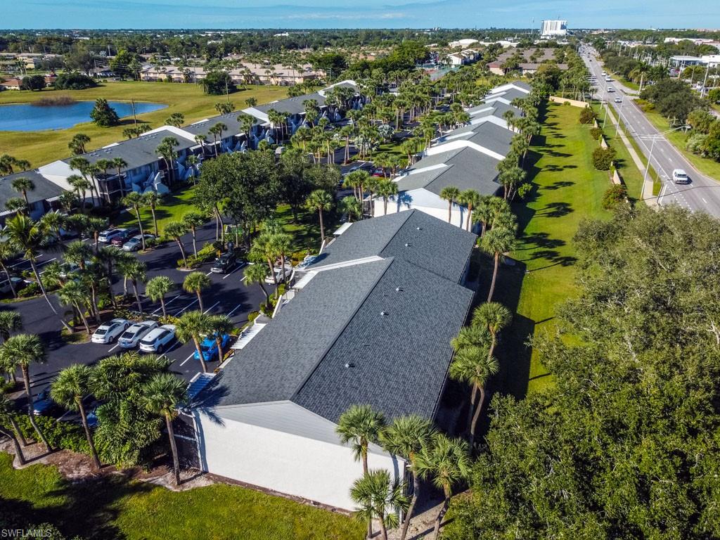 4085 Northlight Drive, Unit 5607 Naples, FL 34112 - Photo 47 of 49 an aerial view of residential houses with outdoor space and swimming pool