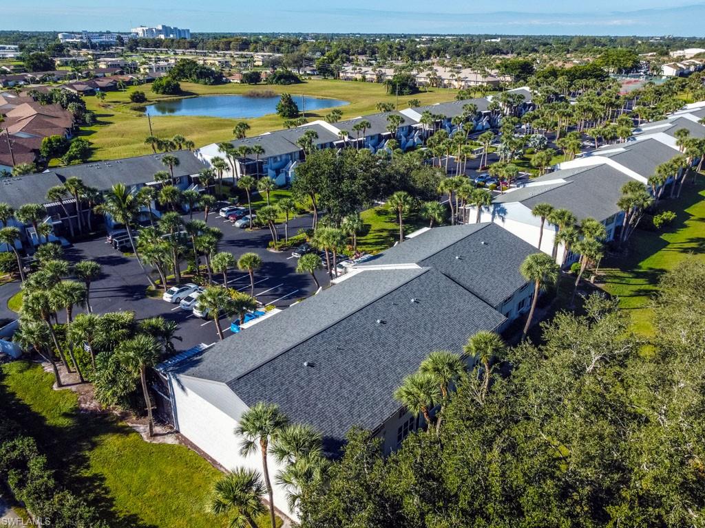 4085 Northlight Drive, Unit 5607 Naples, FL 34112 - Photo 49 of 49 an aerial view of house yard and lake view