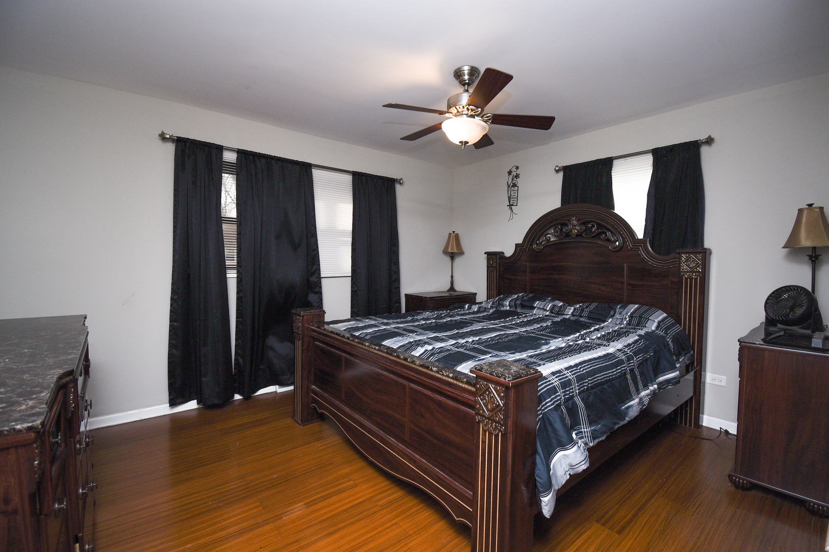 2106 20th Street Zion, IL 60099 - Photo 11 of 22 a bed sitting in a bedroom next to a window