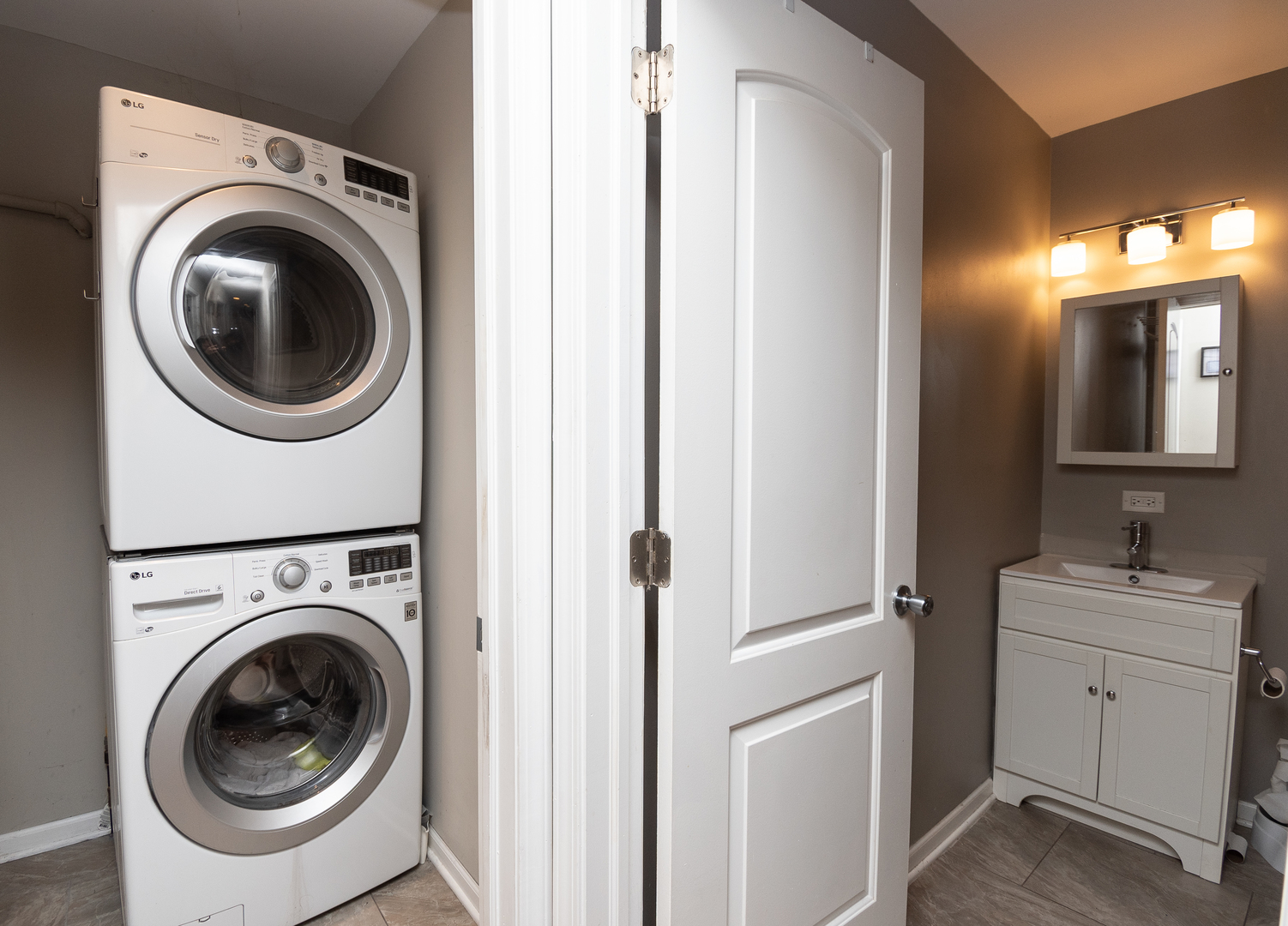 2106 20th Street Zion, IL 60099 - Photo 17 of 22 a view of a hallway with washer and dryer