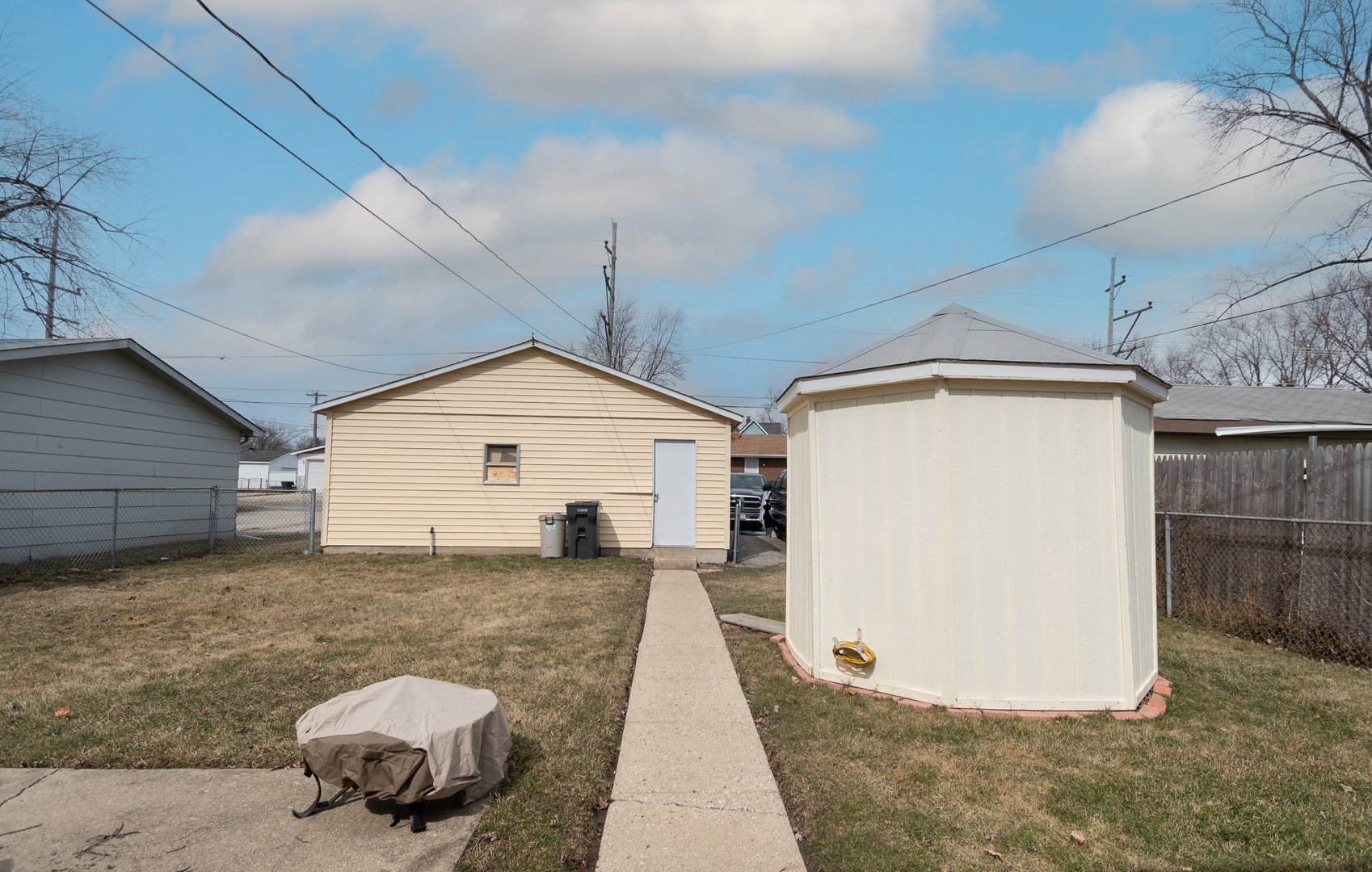 2106 20th Street Zion, IL 60099 - Photo 18 of 22 a front view of a house with a yard