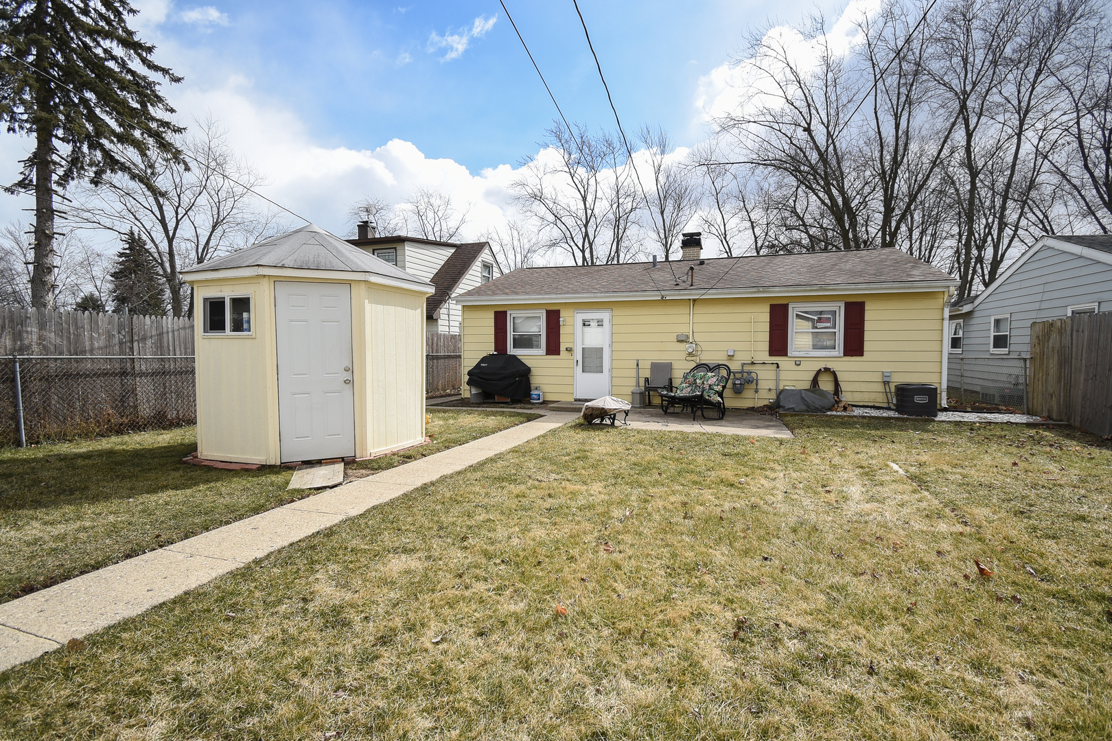 2106 20th Street Zion, IL 60099 - Photo 21 of 22 a view of a house with backyard and a tree
