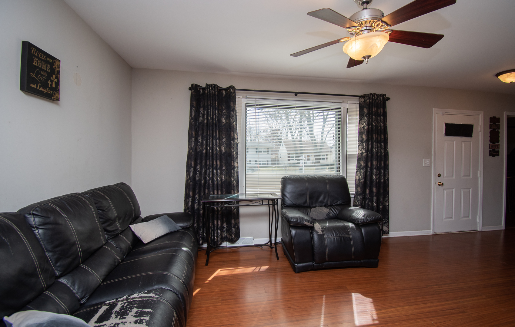 2106 20th Street Zion, IL 60099 - Photo 5 of 22 a living room with furniture and a flat screen tv