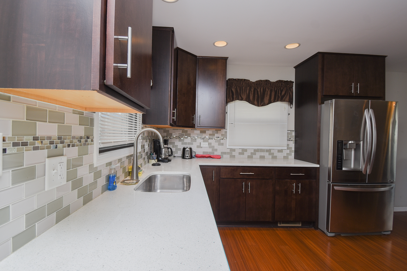 2106 20th Street Zion, IL 60099 - Photo 8 of 22 a kitchen with stainless steel appliances a sink and a refrigerator