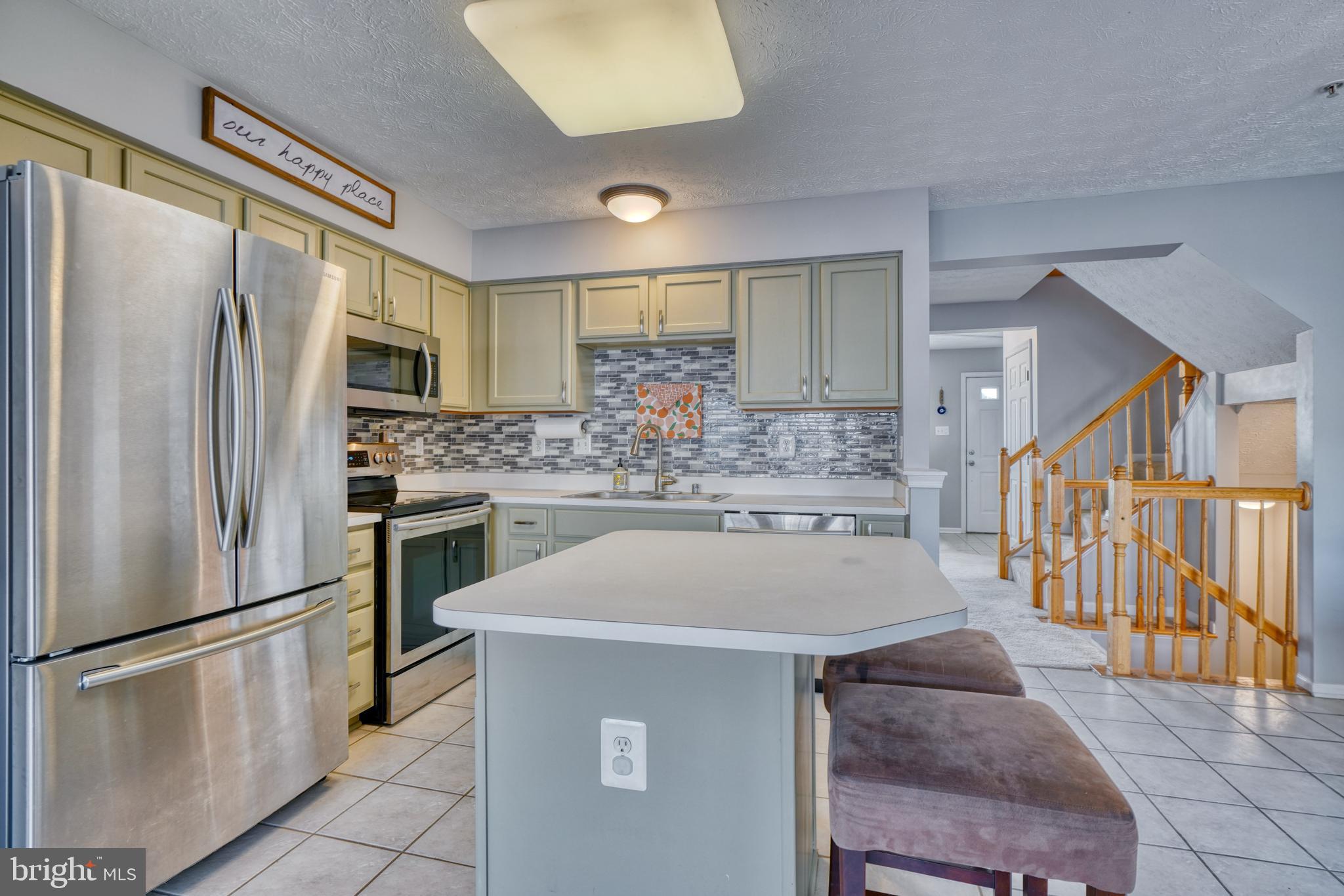 5030 Finsbury Road Rosedale, MD 21237 - Photo 17 of 49 a kitchen with stainless steel appliances a refrigerator and a sink