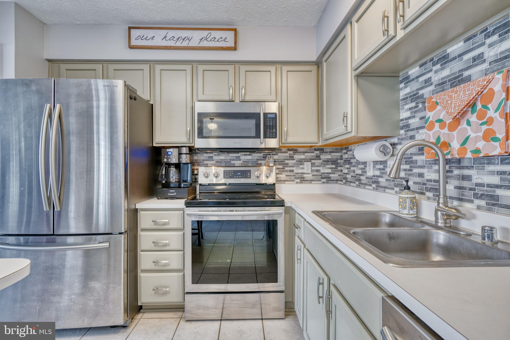 5030 Finsbury Road Rosedale, MD 21237 - Photo 23 of 49 a kitchen with stainless steel appliances a refrigerator sink and microwave