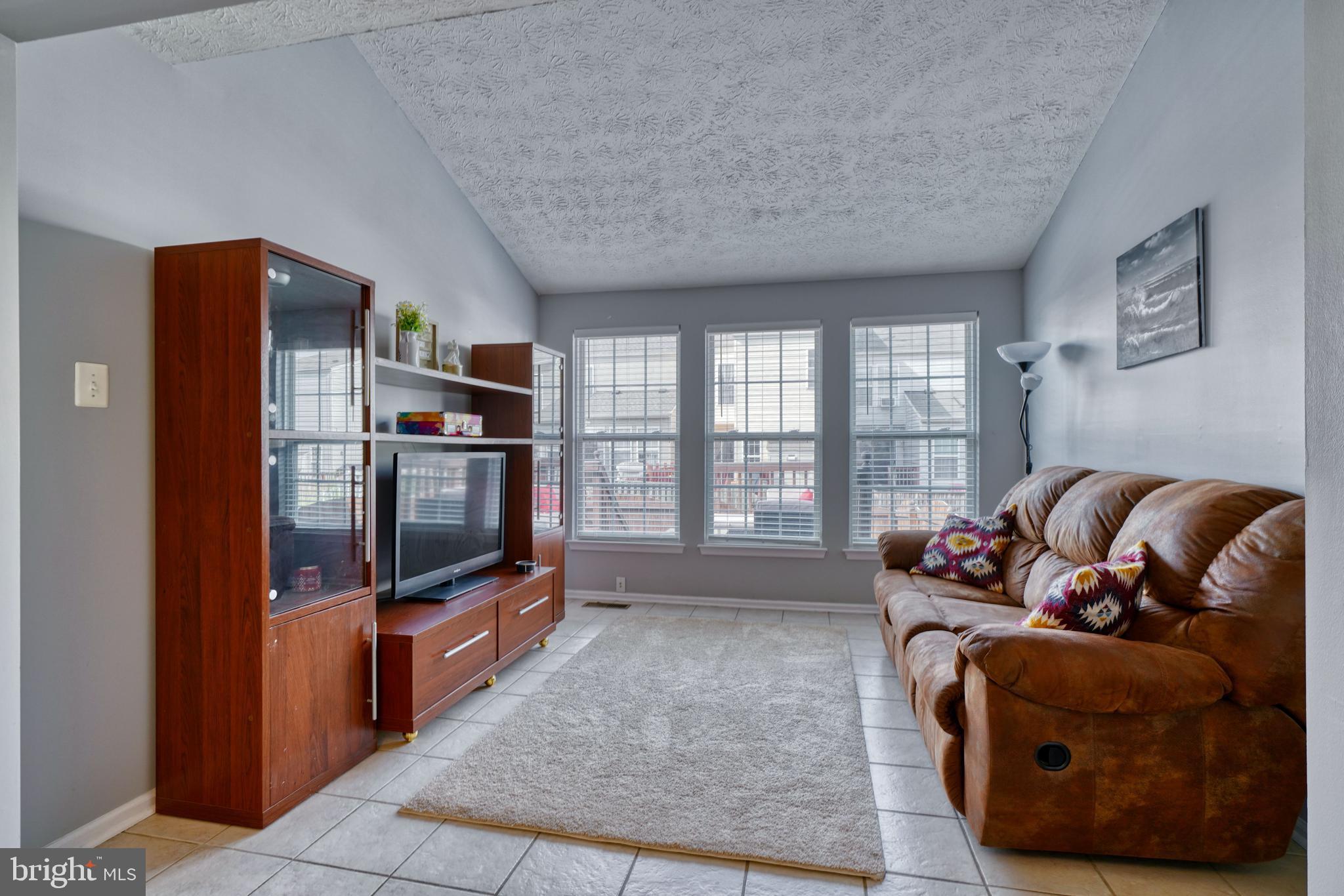 5030 Finsbury Road Rosedale, MD 21237 - Photo 25 of 49 a living room with furniture and a flat screen tv