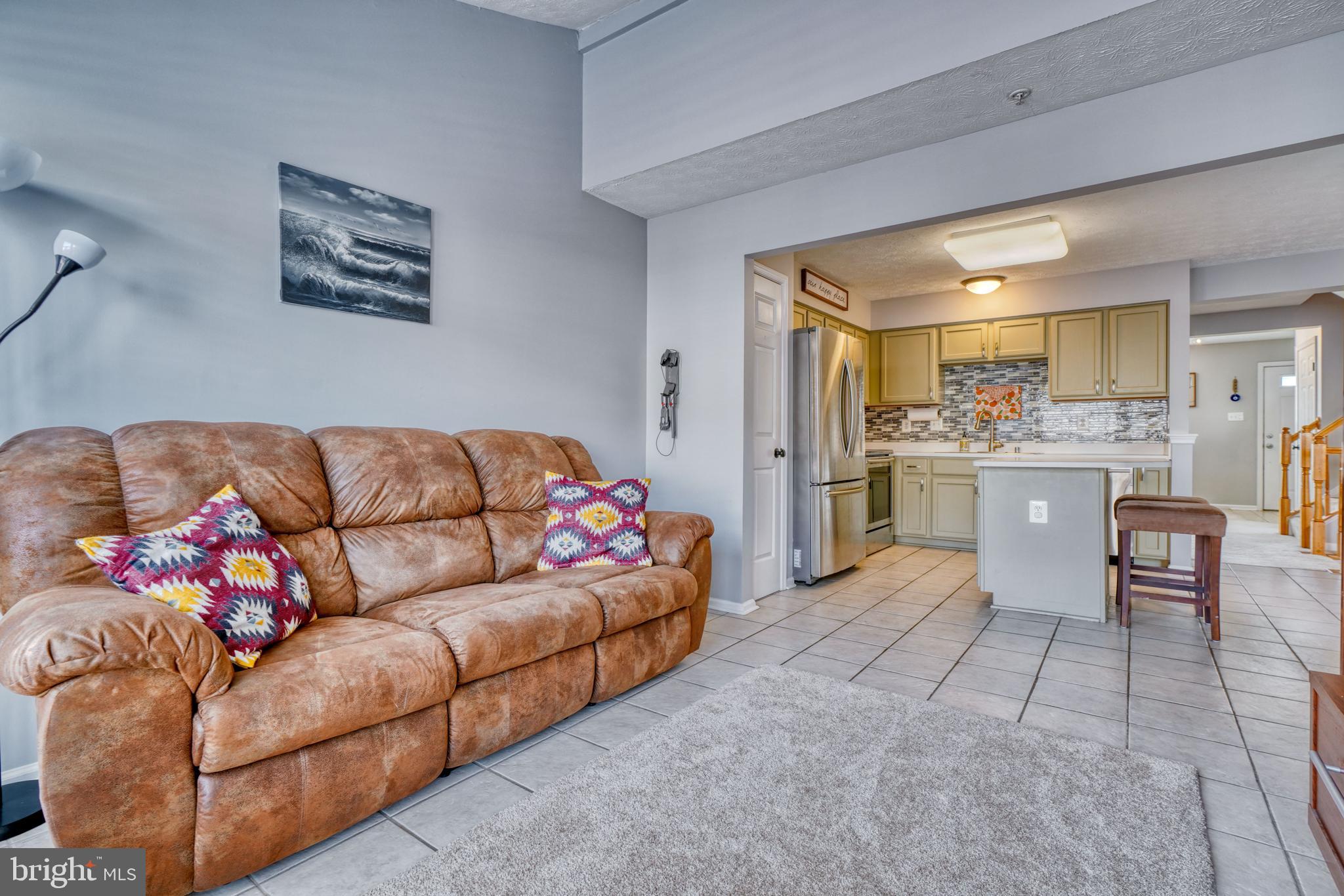 5030 Finsbury Road Rosedale, MD 21237 - Photo 26 of 49 a living room with furniture and kitchen view