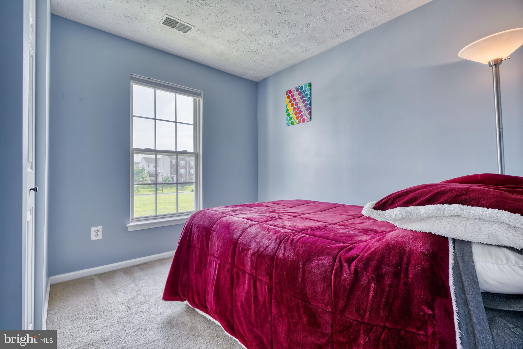 5030 Finsbury Road Rosedale, MD 21237 - Photo 28 of 49 a bedroom with a bed and a window