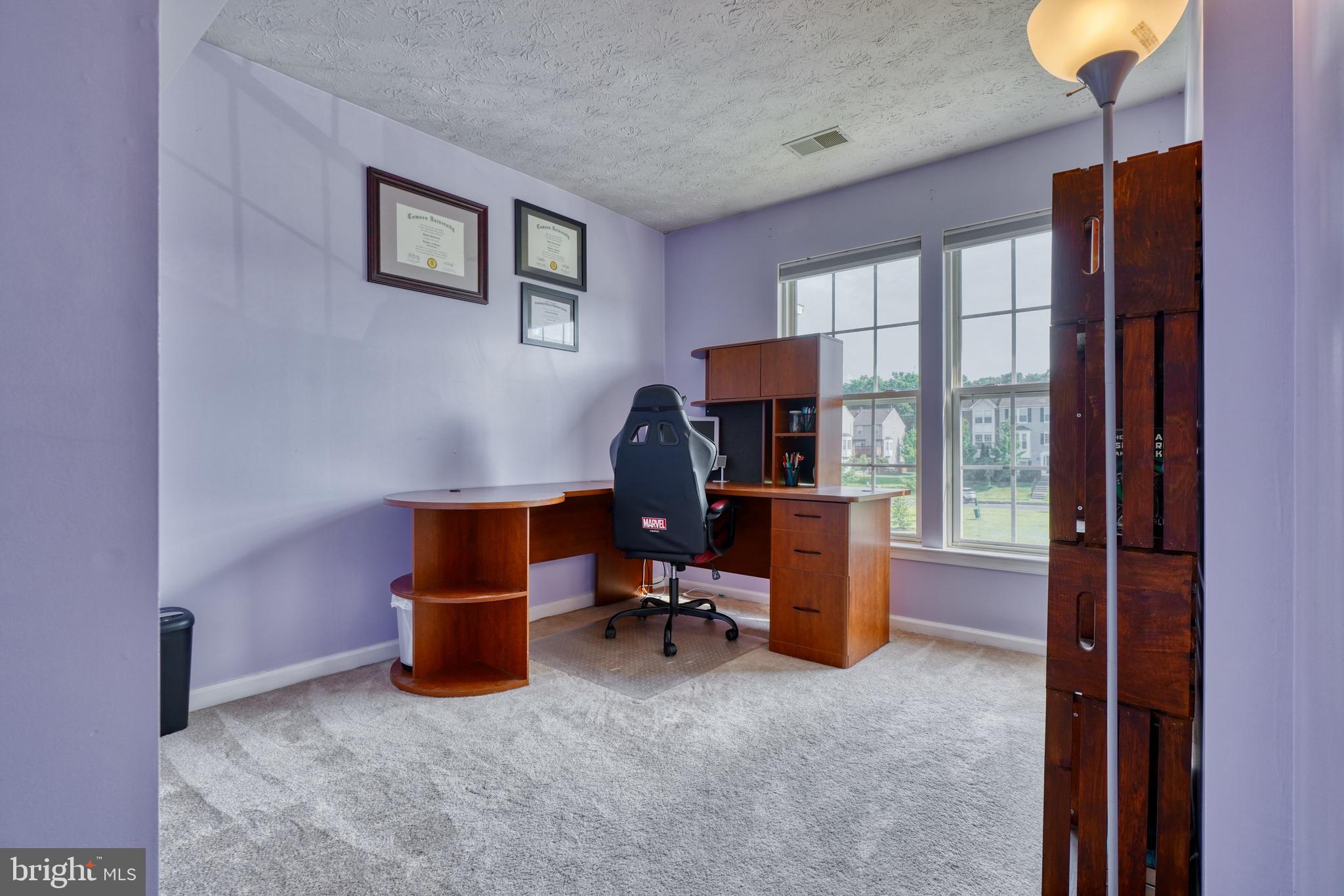 5030 Finsbury Road Rosedale, MD 21237 - Photo 30 of 49 a view of a workspace with furniture and a window