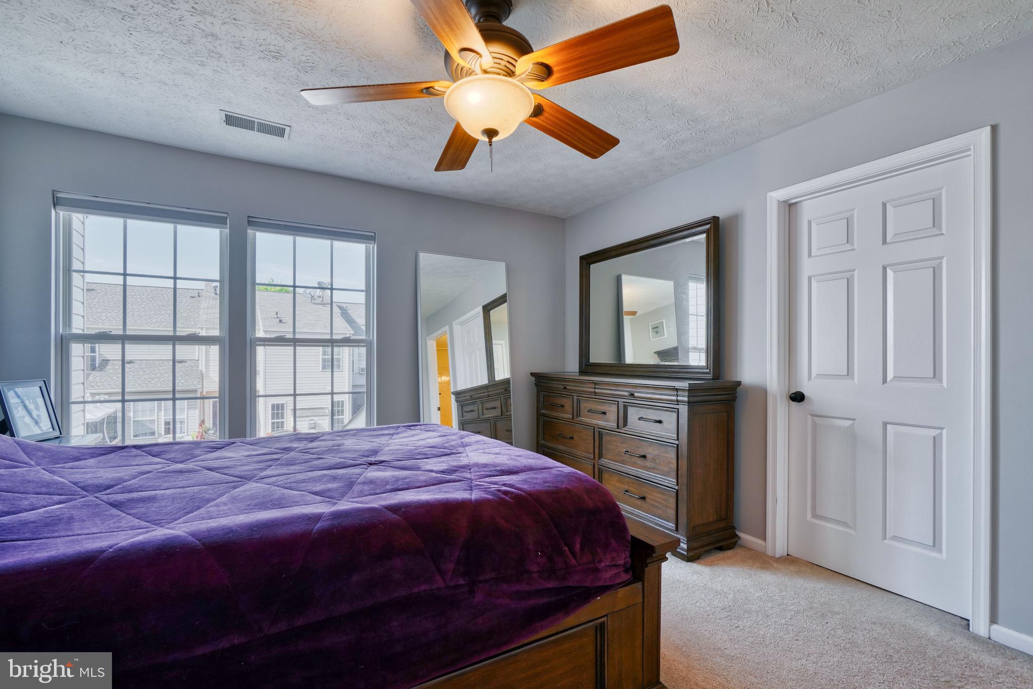 5030 Finsbury Road Rosedale, MD 21237 - Photo 37 of 49 a bedroom with a large bed and a tv