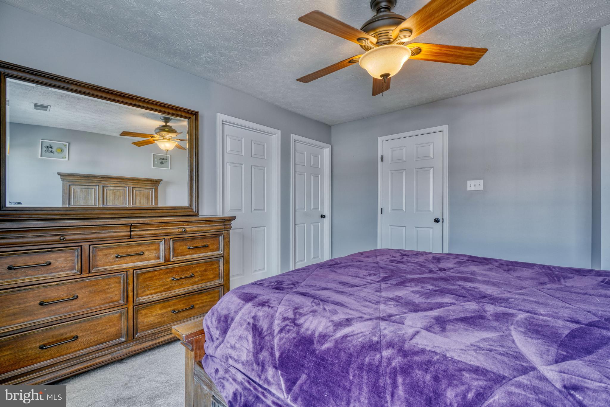 5030 Finsbury Road Rosedale, MD 21237 - Photo 39 of 49 a bedroom with a bed and a chandelier