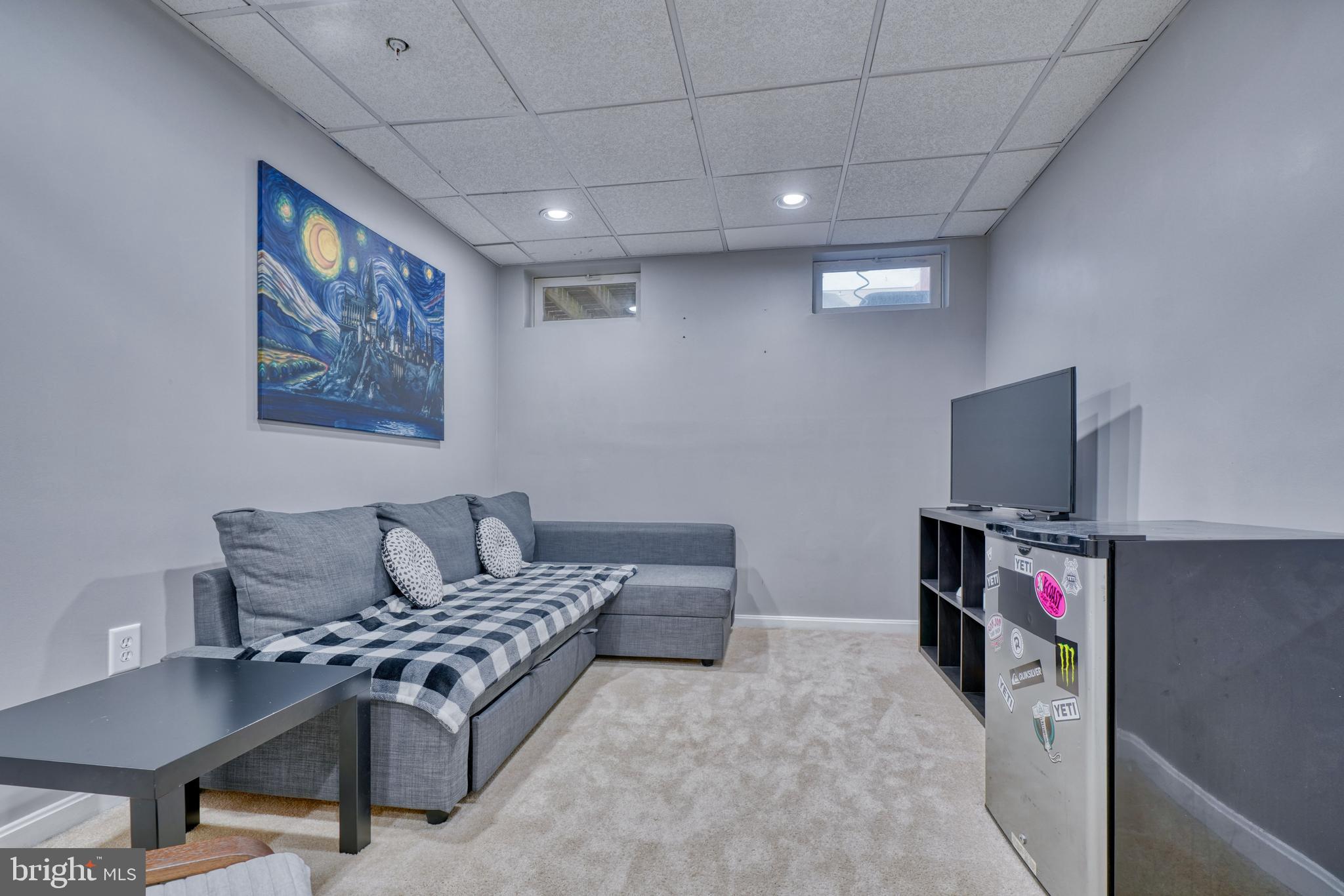 5030 Finsbury Road Rosedale, MD 21237 - Photo 42 of 49 a living room with furniture and a flat screen tv