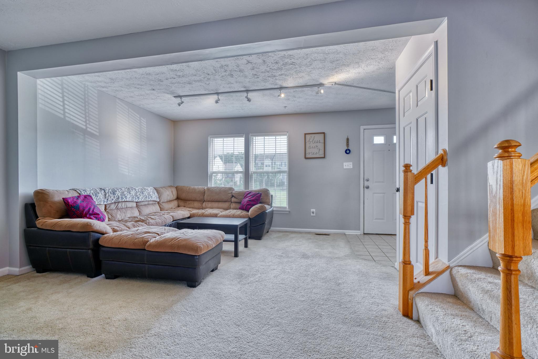 5030 Finsbury Road Rosedale, MD 21237 - Photo 5 of 49 a living room with furniture and a mirror