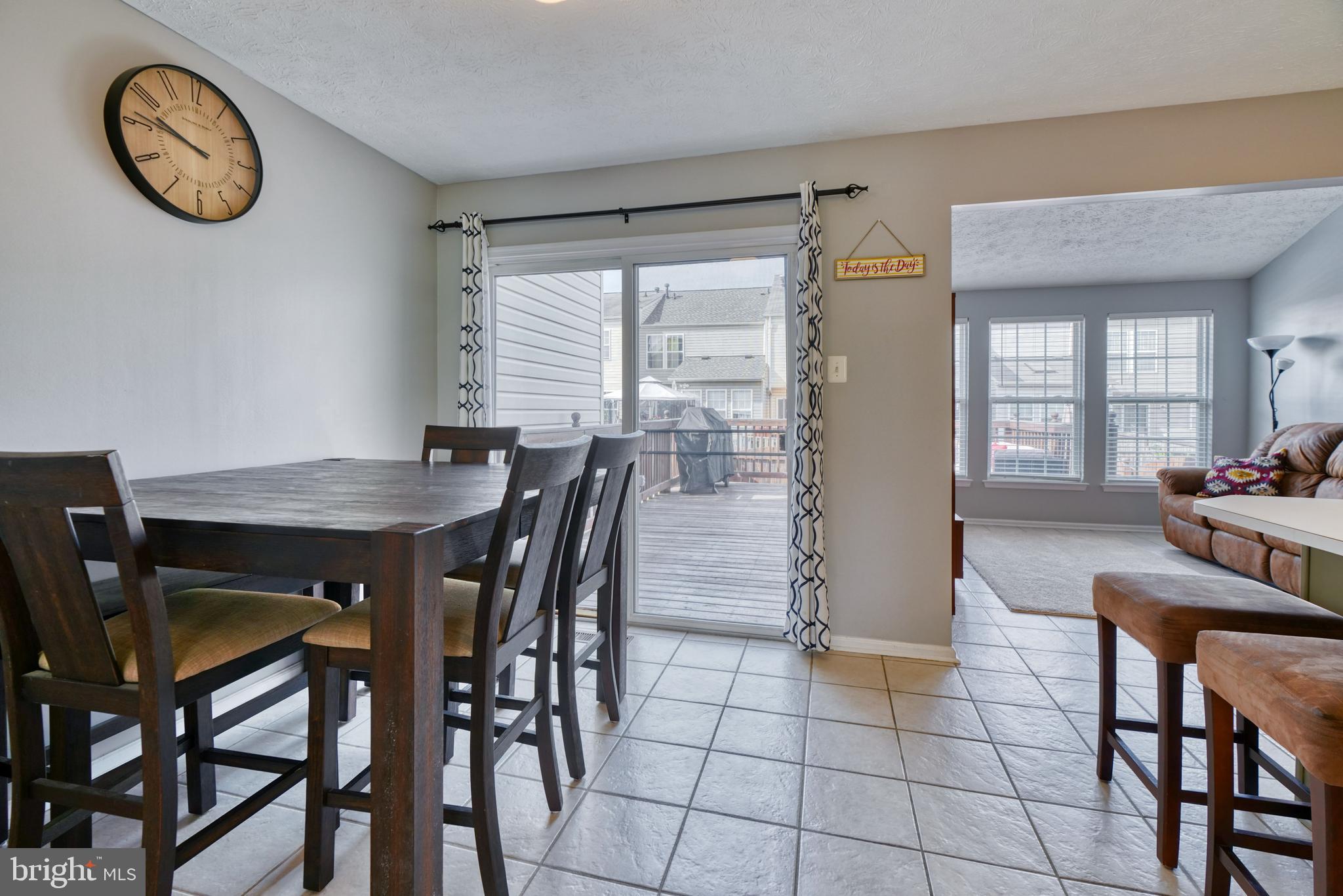 5030 Finsbury Road Rosedale, MD 21237 - Photo 9 of 49 a view of a dining room with furniture and a large window