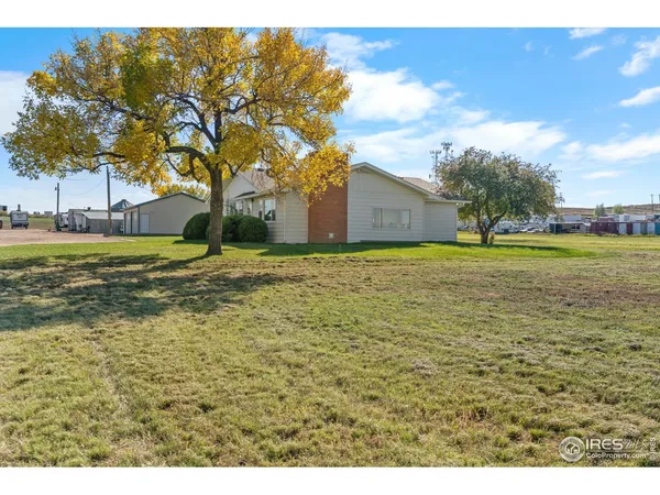 a view of a house with a big yard