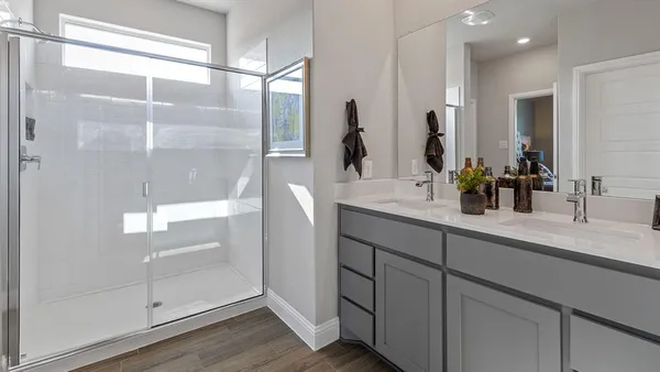 a bedroom with a bed and a mirror