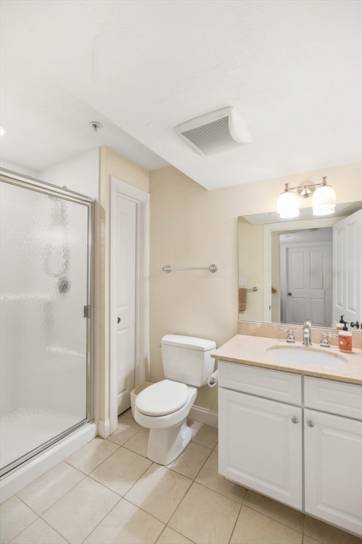 6 Essex Road, Unit 8 Ipswich, MA 01938 - Photo 28 of 35 a spacious bathroom with a sink toilet a shower and a mirror