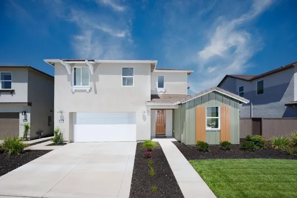 a front view of a house with yard