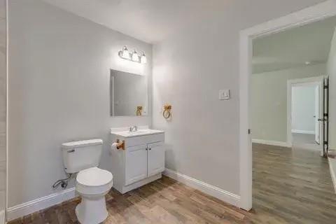 221 Braz Street Bonham, TX 75418 - Photo 10 of 12 Bathroom with vanity and light wood-type flooring