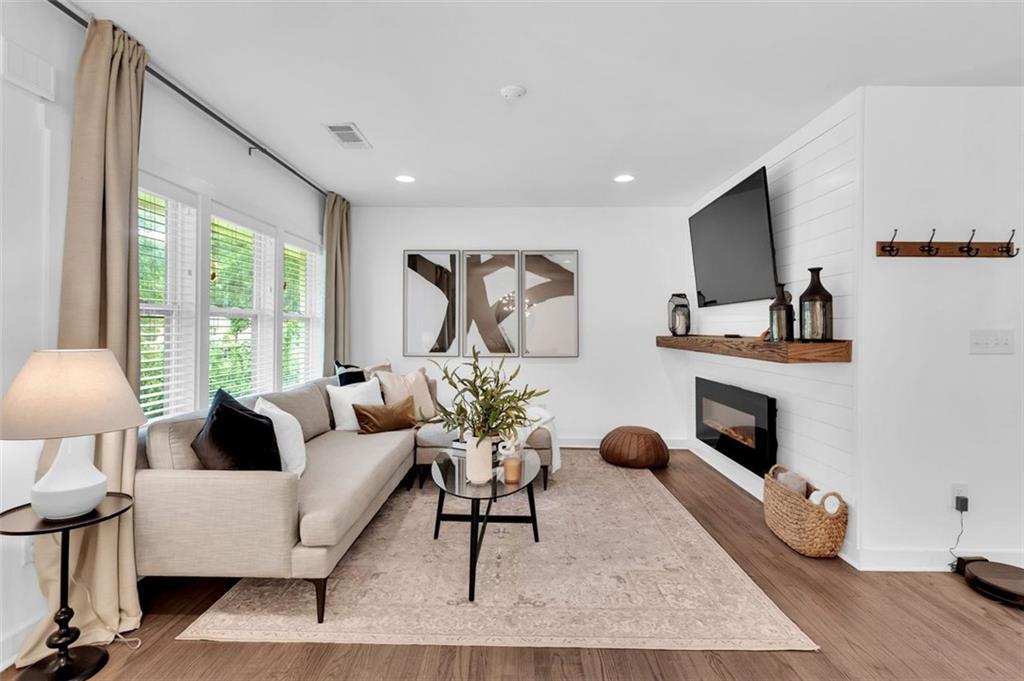 2825 Long Way Decatur, GA 30032 - Photo 1 of 1 a living room with furniture a fireplace and a flat screen tv
