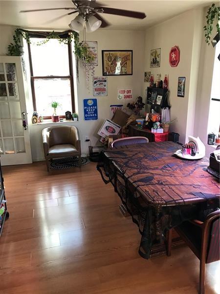 2918 Leander Street Pittsburgh, PA 15219 - Photo 4 of 9 a bedroom with furniture window and wooden floor