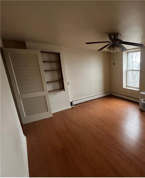 2918 Leander Street Pittsburgh, PA 15219 - Photo 6 of 9 an empty room with windows