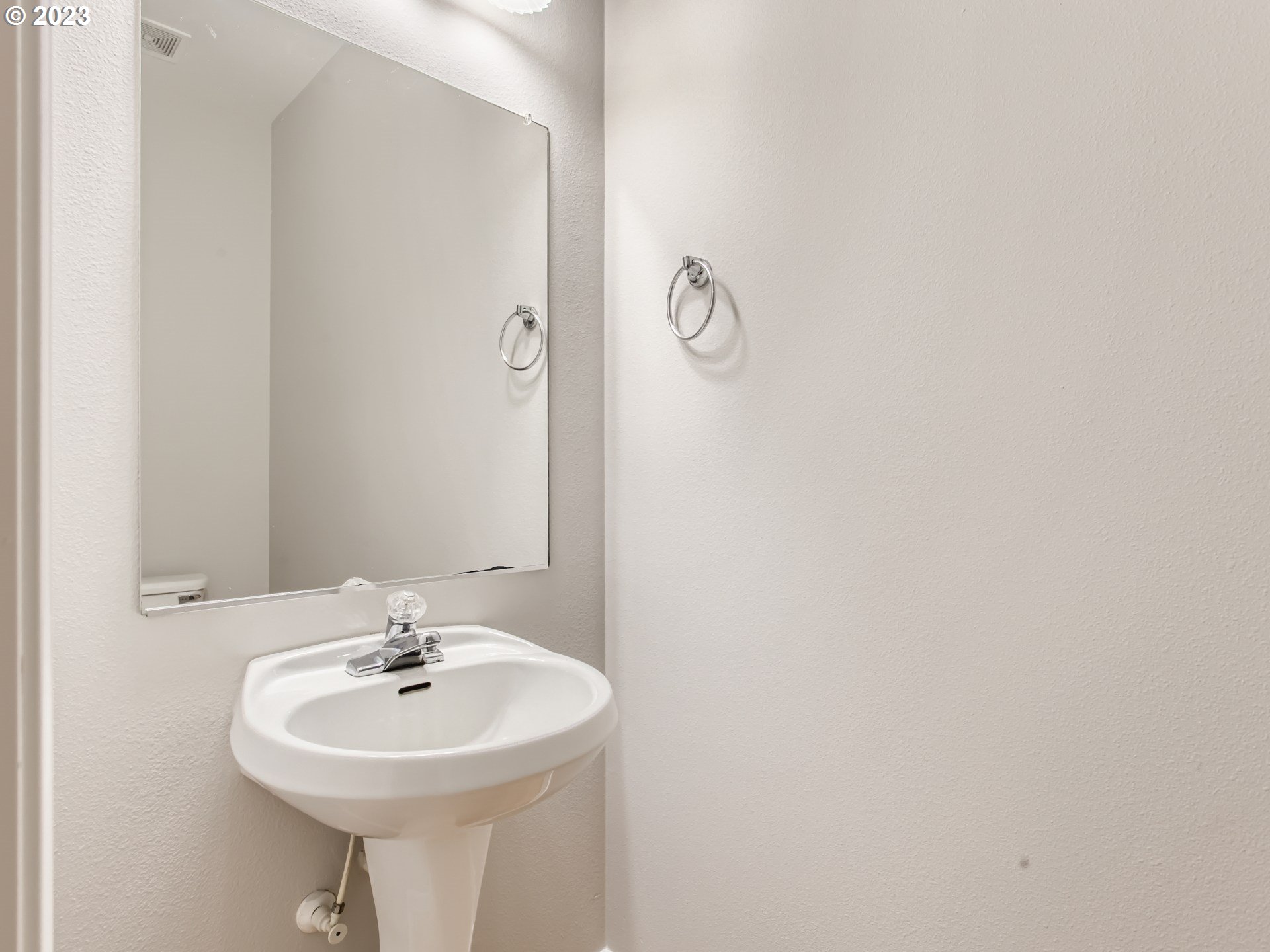 5877 Southeast 15th Drive Gresham, OR 97080 - Photo 12 of 27 a bathroom with a sink and a mirror