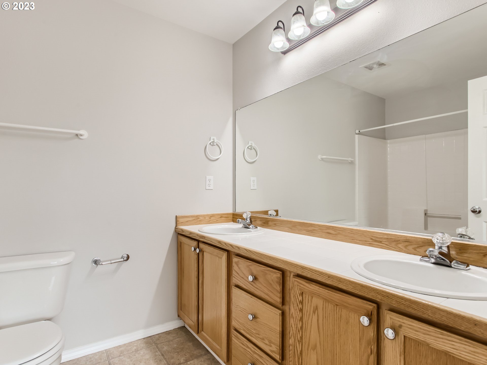 5877 Southeast 15th Drive Gresham, OR 97080 - Photo 16 of 27 a bathroom with a sink and a toilet