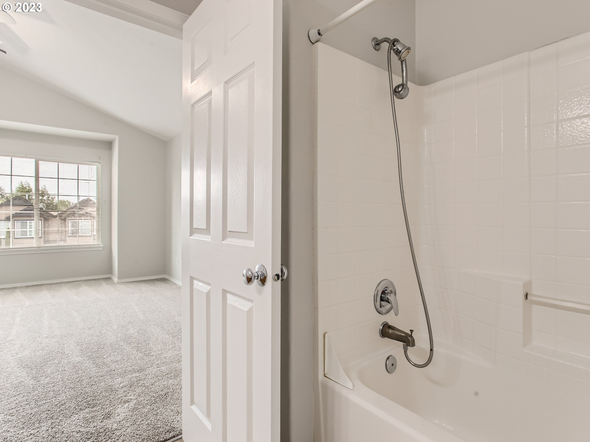5877 Southeast 15th Drive Gresham, OR 97080 - Photo 17 of 27 a view of a bathroom with a bathtub