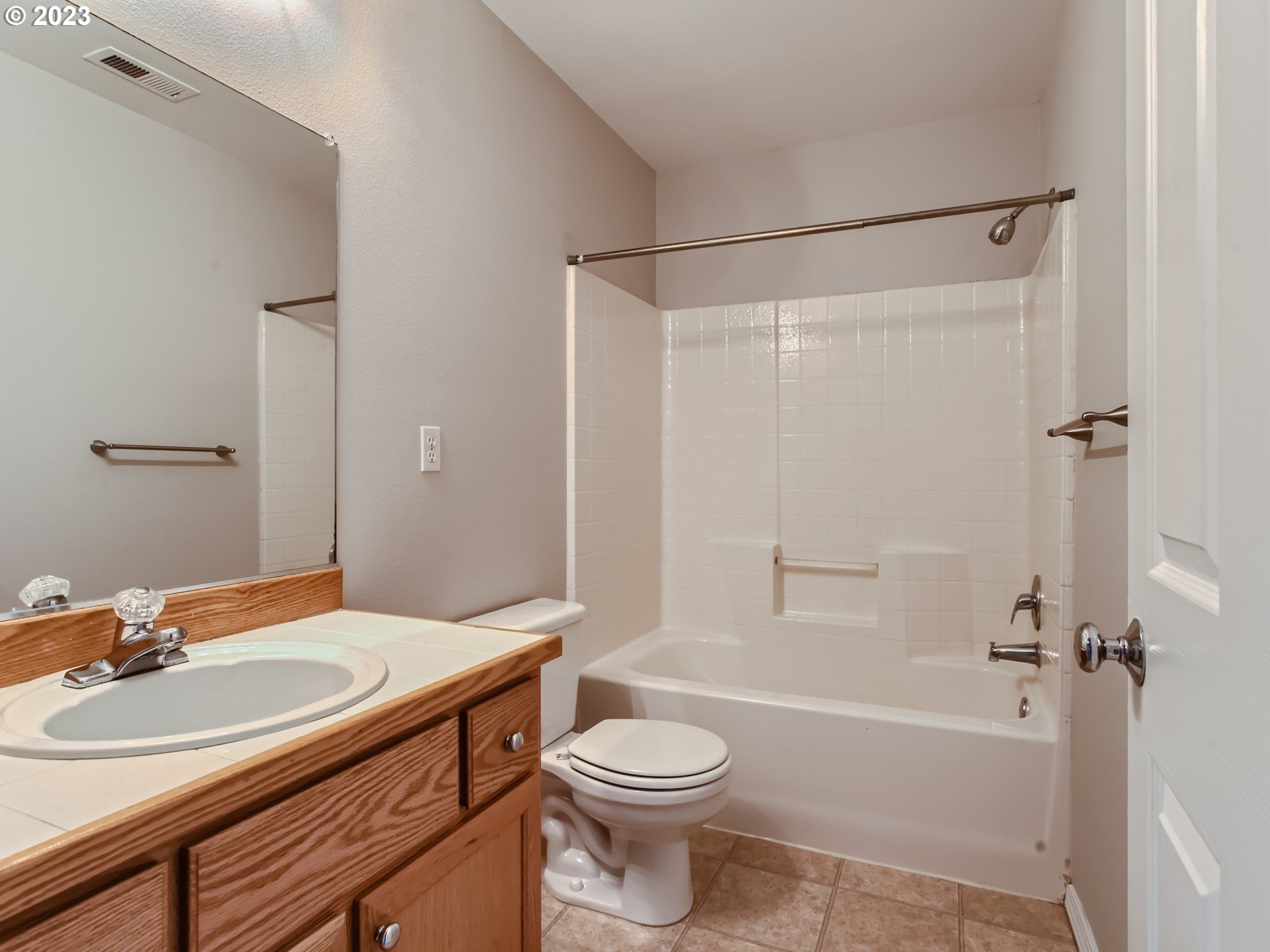 5877 Southeast 15th Drive Gresham, OR 97080 - Photo 22 of 27 a bathroom with a sink a toilet and a mirror